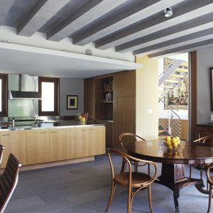 A bright kitchen showcasing a table with chairs
