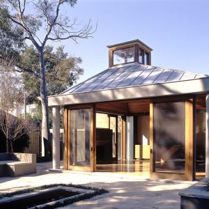 A small building featuring a distinct roof