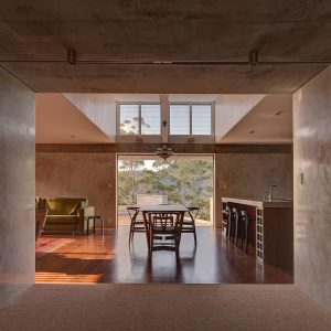 A perspective from the living room displaying the dining room and kitchen area